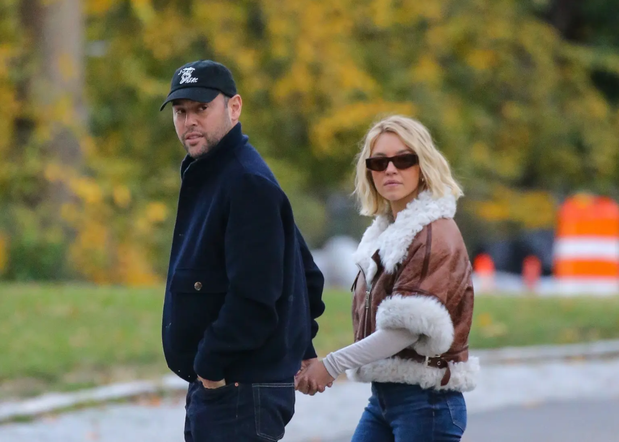Sydney Sweeney and Scooter Braun holding hands