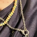 Gigi Hadid Sparks Buzz with Gold “Love” Pendant Honoring Bradley Cooper
